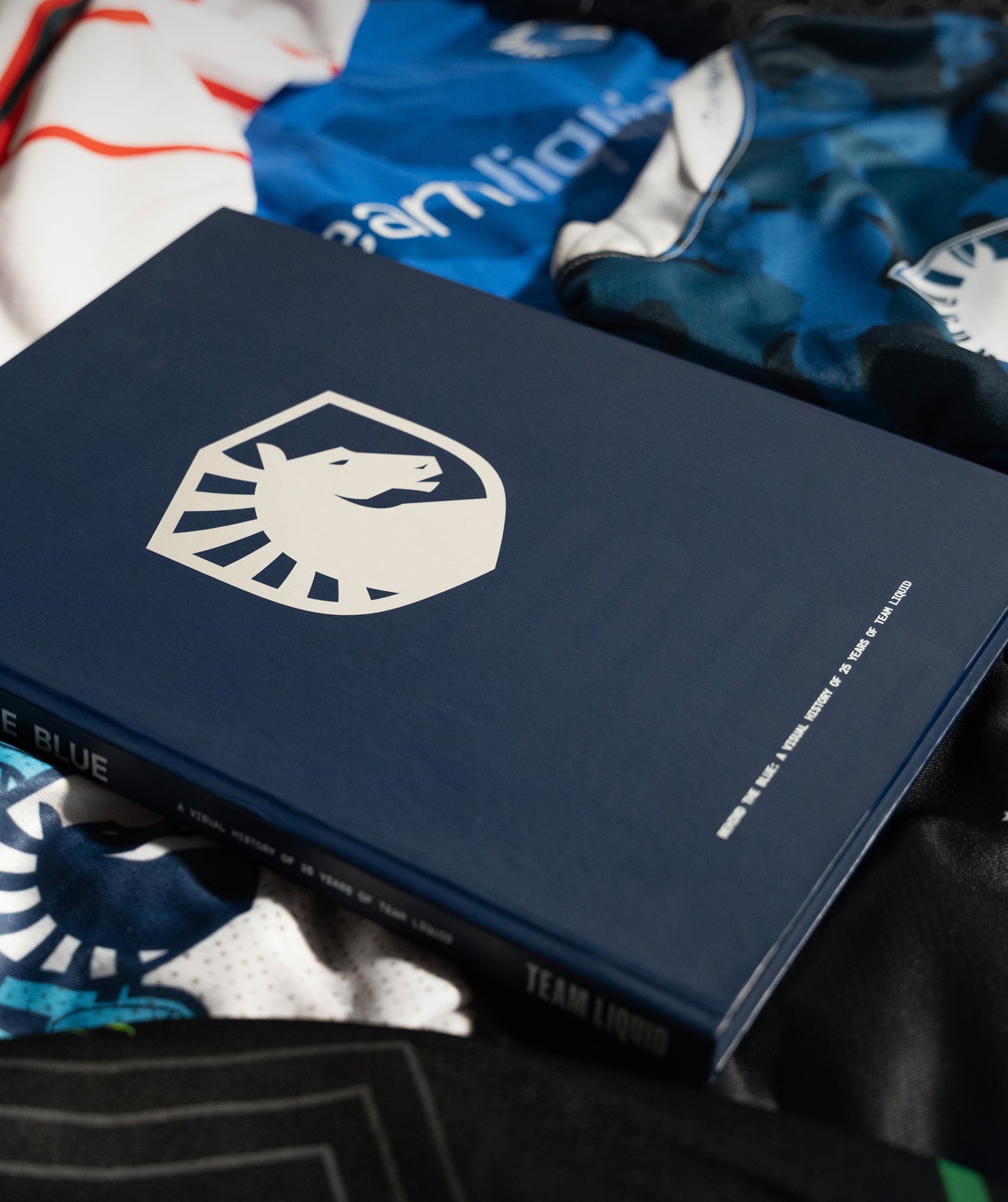 BEHIND THE BLUE: A VISUAL HISTORY OF 25 YEARS OF TEAM LIQUID